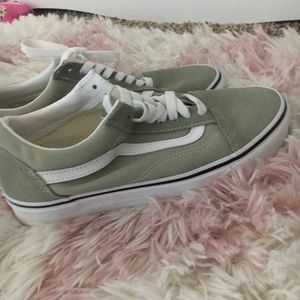 Green and white vans